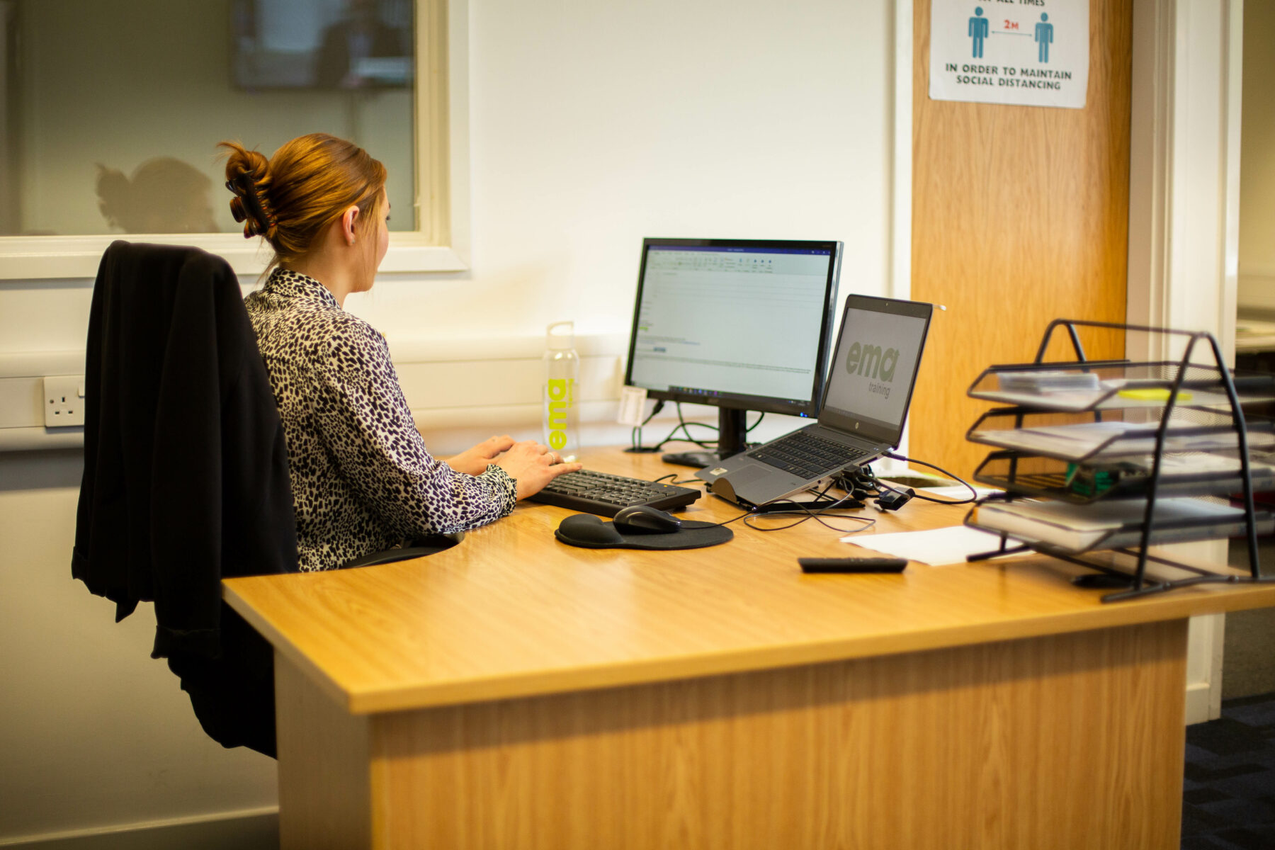 EMA's Finance Manager, Rosie, working in EMA Training's Finance Hub in Derby City Centre. Finance Manager is one of the many careers at EMA Training.