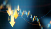 Down arrows over blue financial graph background. Horizontal composition with selective focus and copy space. Investment, stock market data and finance concept.