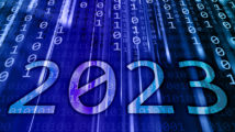 2023 text written on a blue flowing binary code background. New Year 2023 celebration concept.